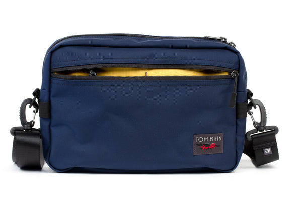 The Side Hustle in Deep Blue Ballistic with Marigold 210 Cerylon interior.